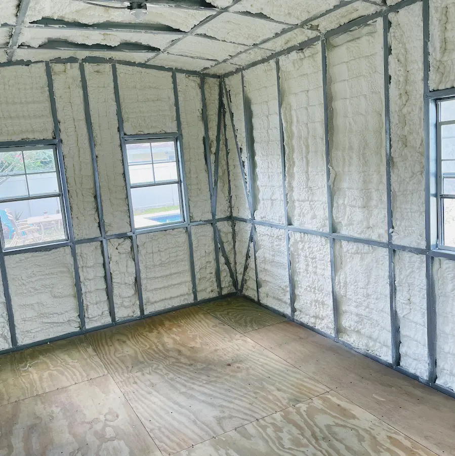 Closed-cell spray foam insulation applied to wall cavities in a residential project in Jennings